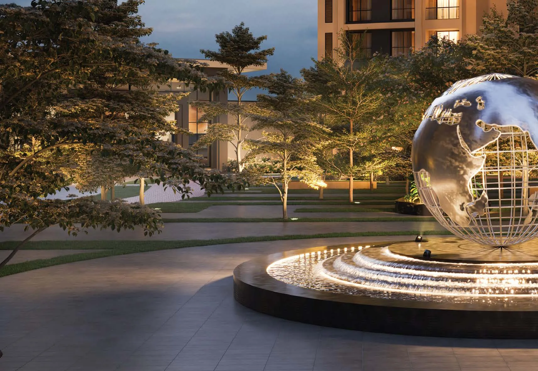 Signature Illuminated Globe Fountain Plaza at Dusk
